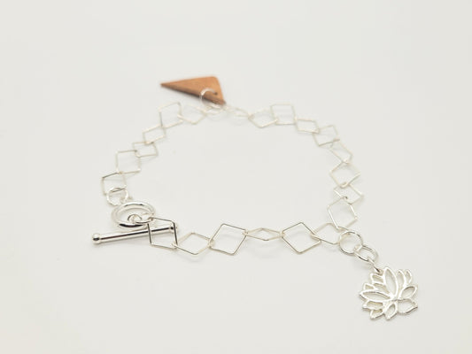 Sterling silver bracelet with a birch bark and sterling silver pendant