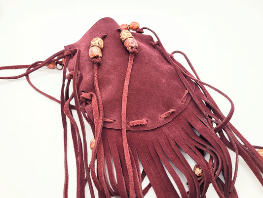 Maroon leather pouch with wood beads
