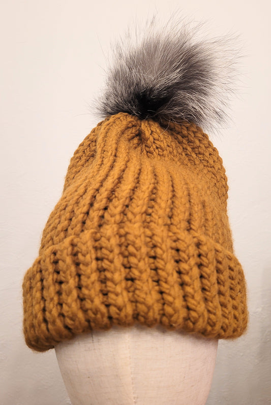 Butterscotch wool and acrylic hat with a silver fox fur pompom