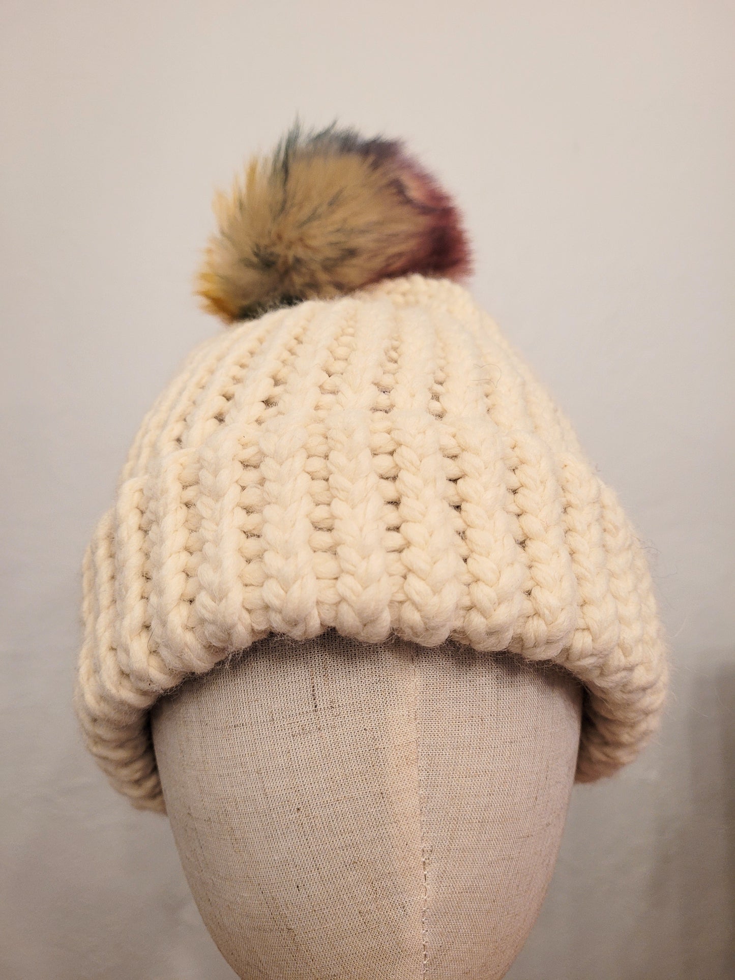 Cream wool and acrylic hat, faux coloured pompom