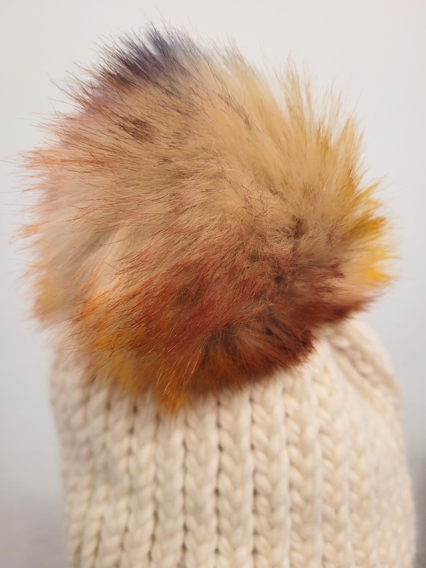 Cream wool and acrylic hat, faux coloured pompom