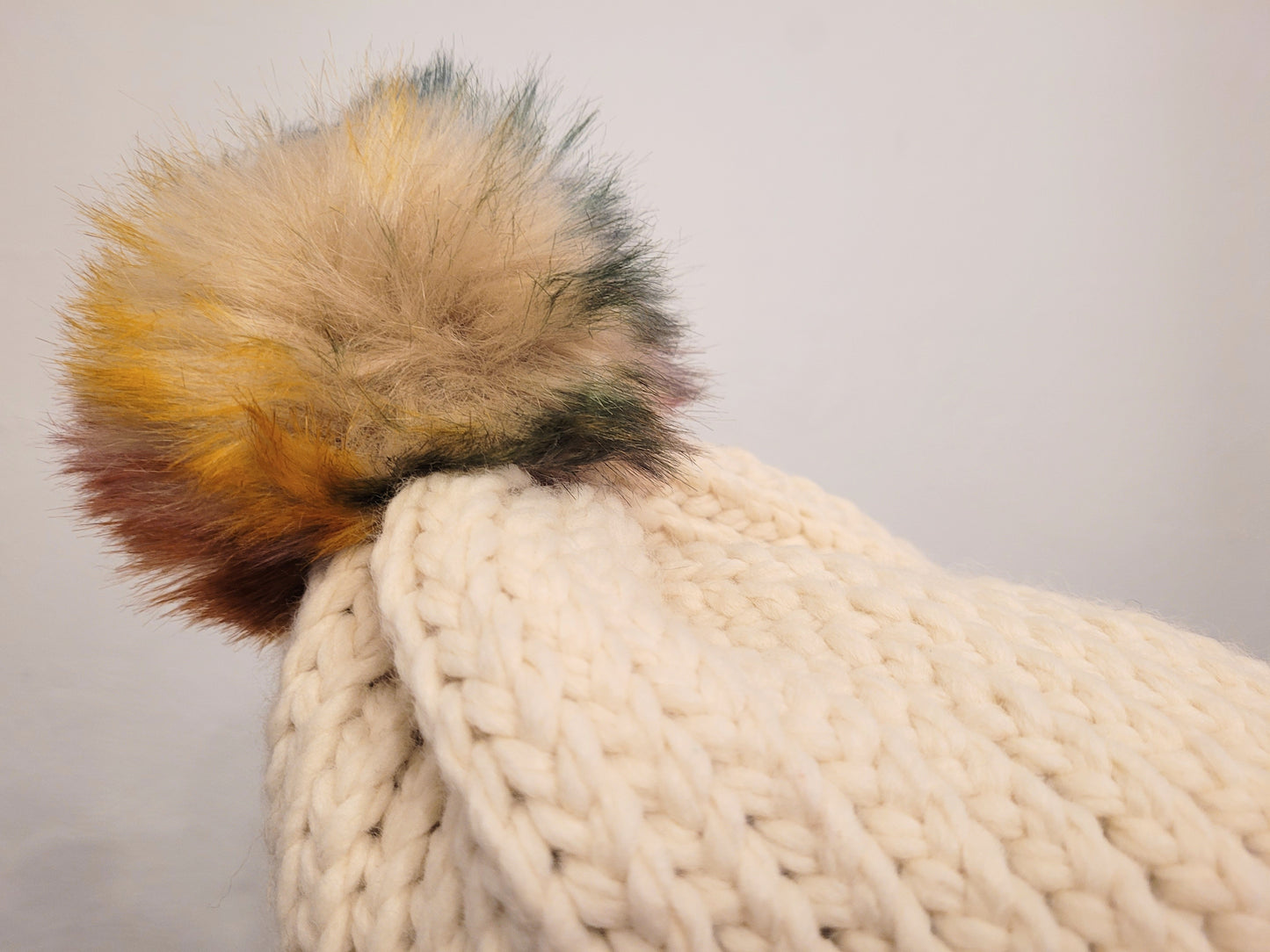 Cream wool and acrylic hat, faux coloured pompom