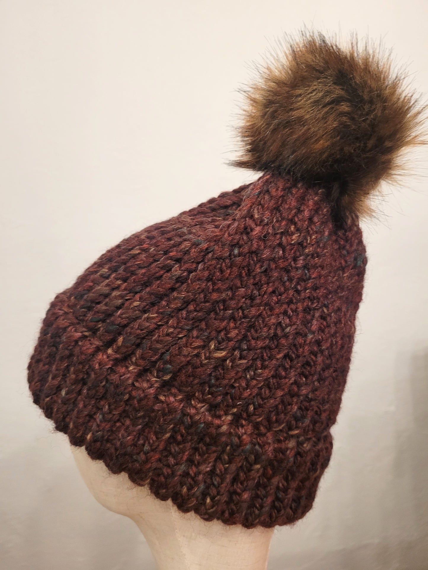 Burgundy wool and acrylic hat, faux brown pompom