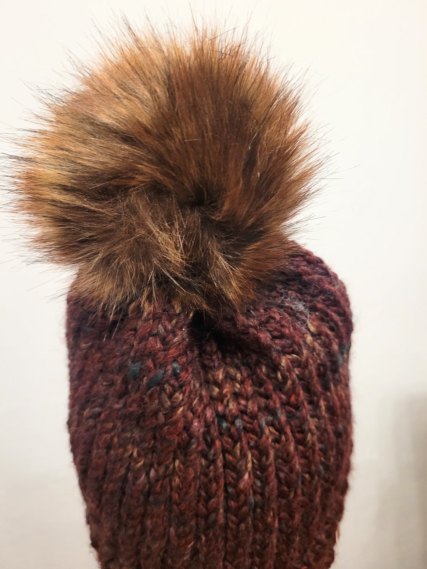 Burgundy wool and acrylic hat, faux brown pompom