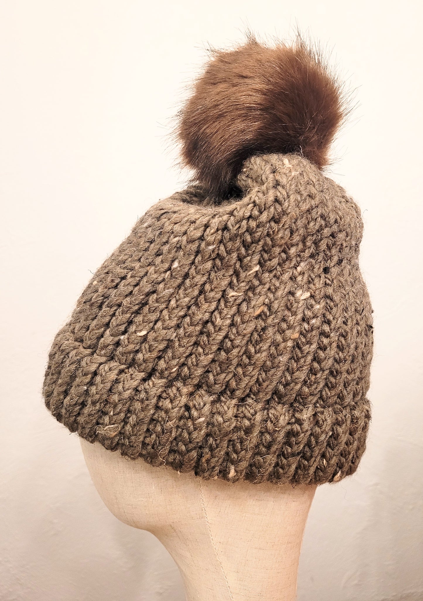 Army green wool and acrylic hat with brown faux pompom